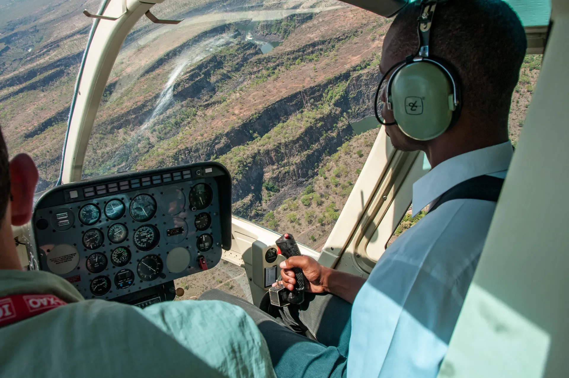 Helicopter flip experience at Monwana Lodge with expert pilots flying over the African bush.