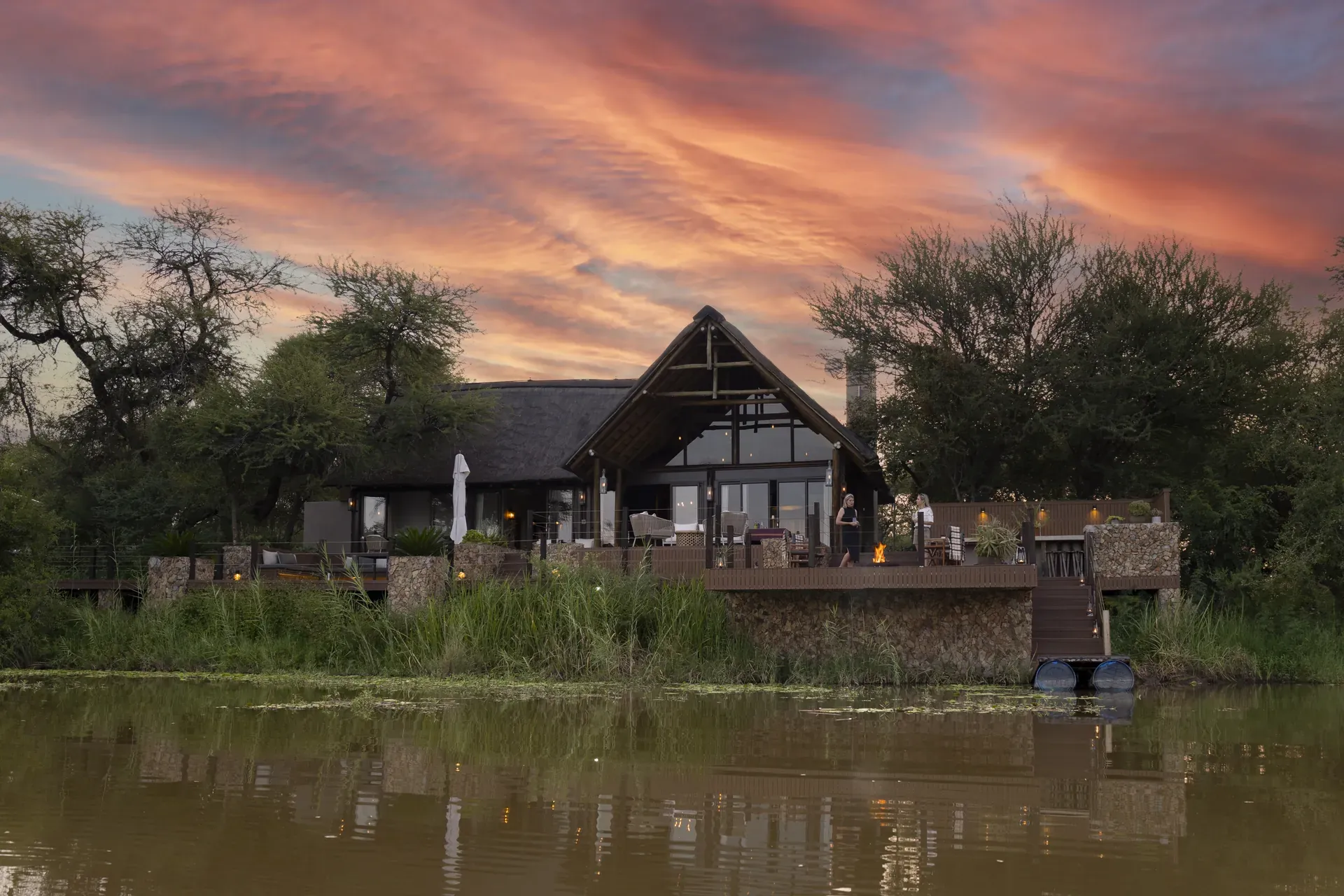 Marataba Residence – Sunset view of the residence from a boat on the river.