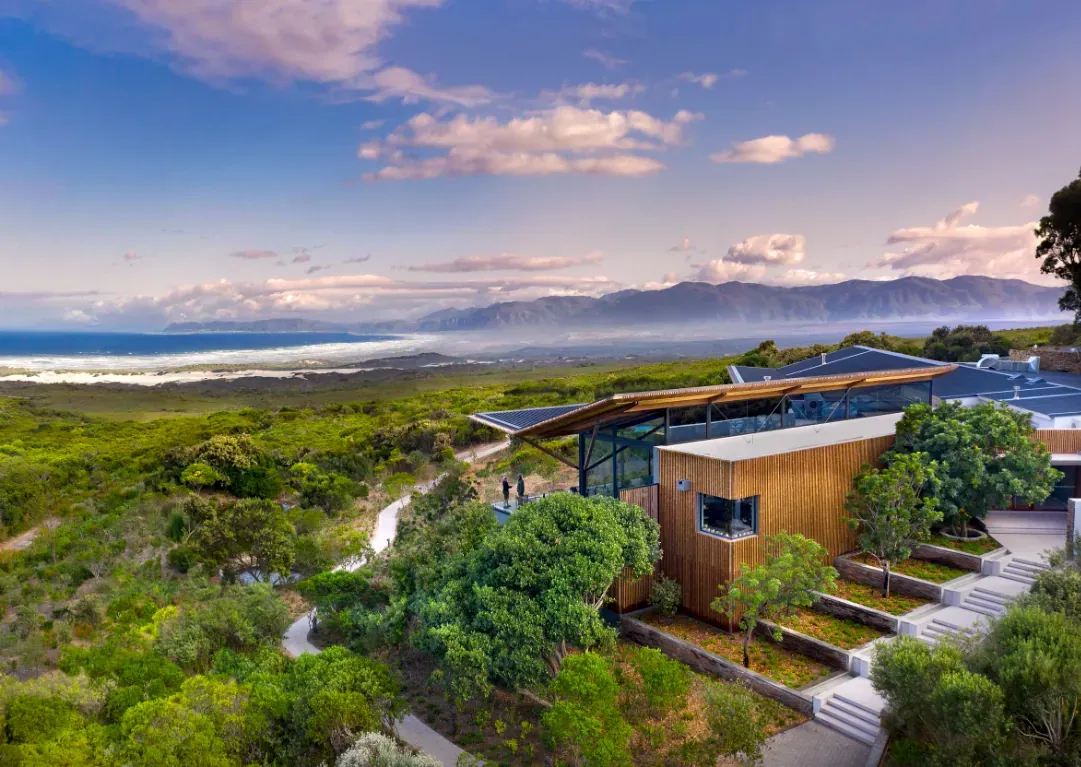 Grootbos Private Nature Reserve with a luxurious lodge set on a hillside overlooking lush gardens and the distant ocean